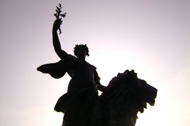 Woman angel statue at Buckingham Palace, England